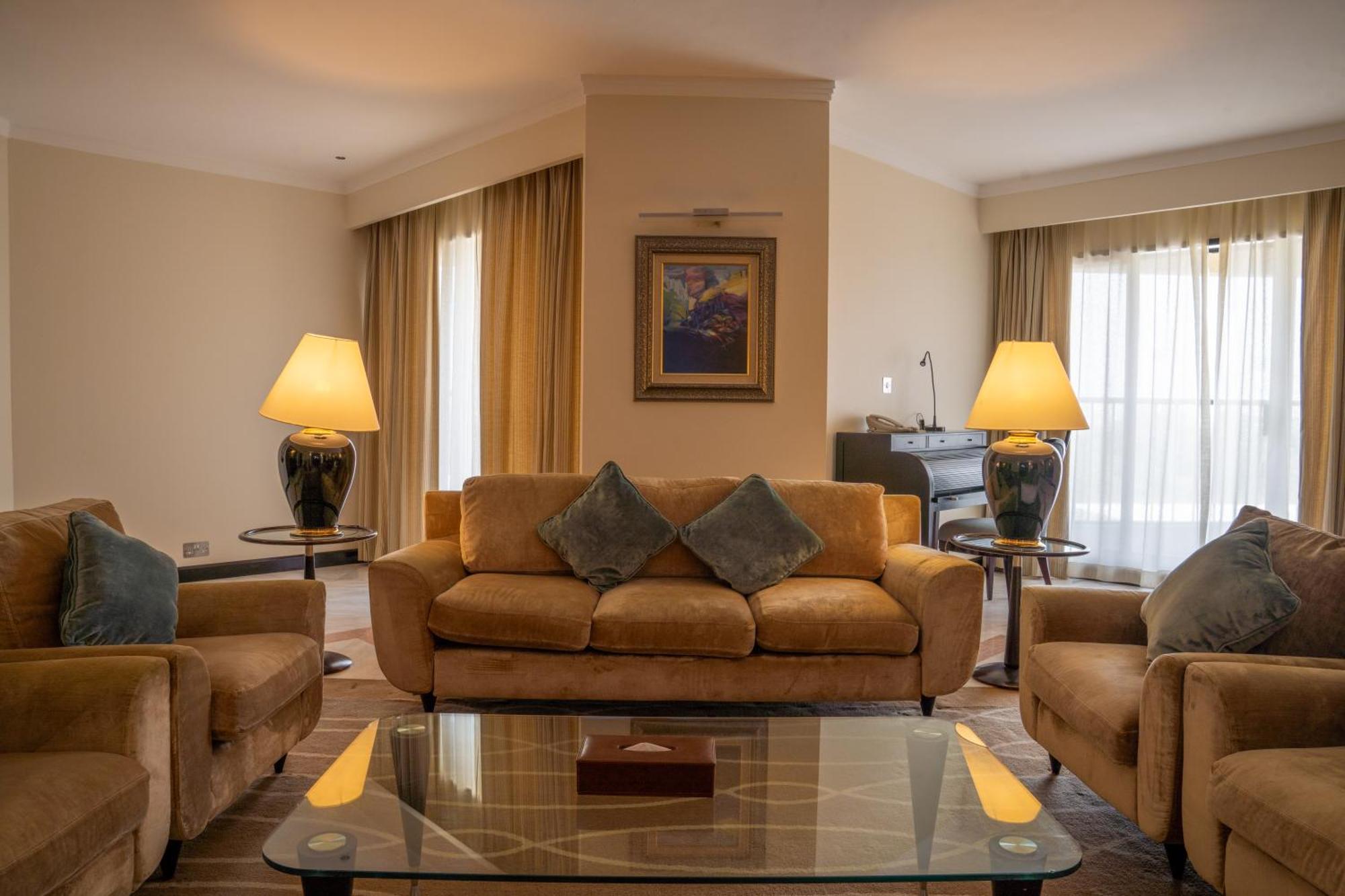 Danat Al Ain Resort Екстериор снимка A living room in a suite at the hotel