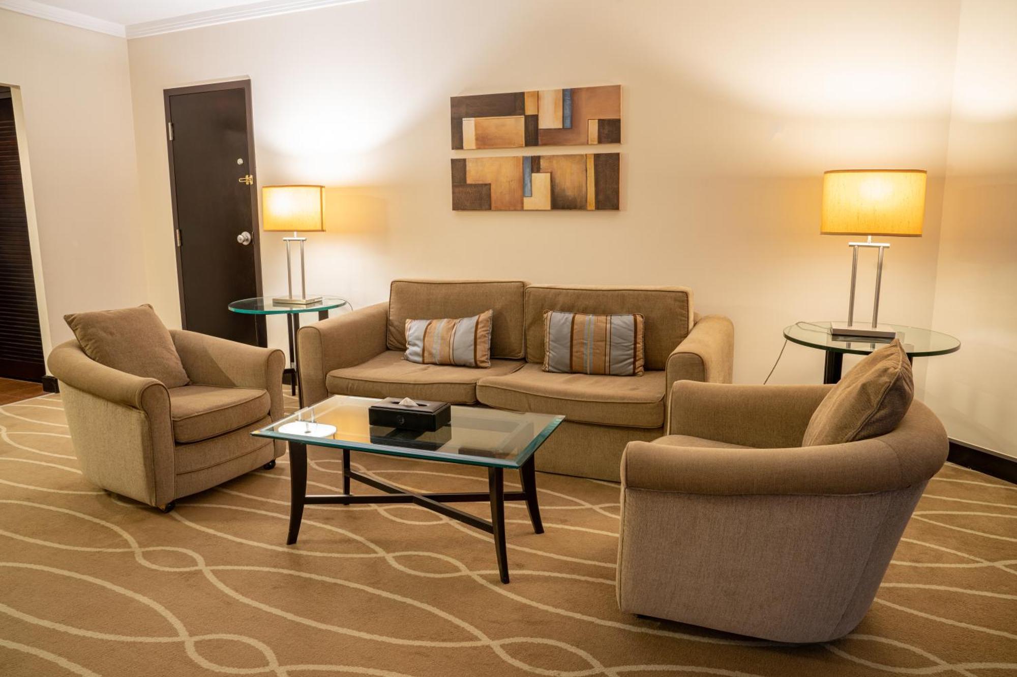 Danat Al Ain Resort Екстериор снимка A living room in a suite at the Fairmont