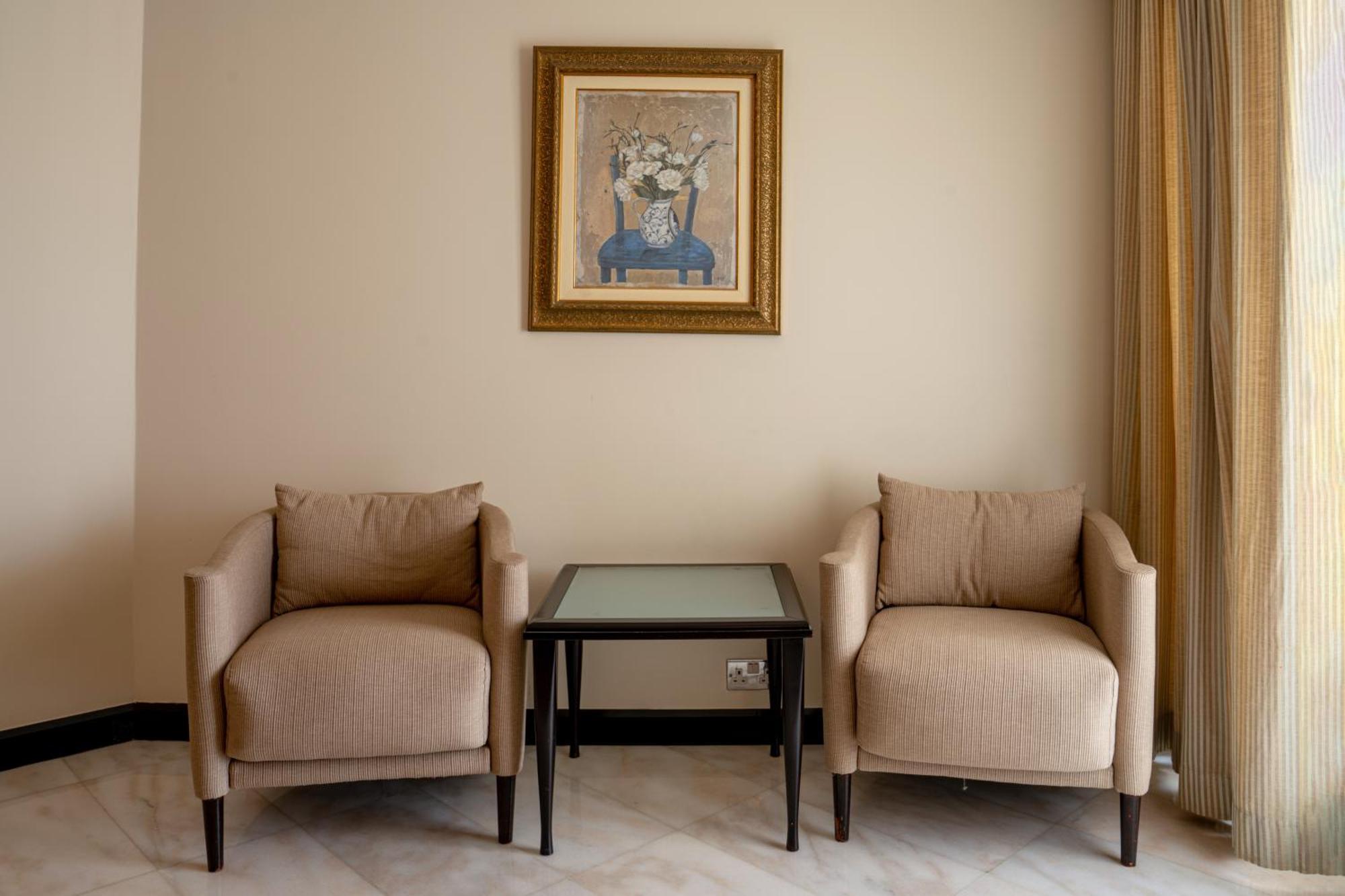 Danat Al Ain Resort Екстериор снимка Two club chairs